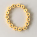 Butter Yellow Daisy Clay Bead Stretch Bracelet with Gold Spacers