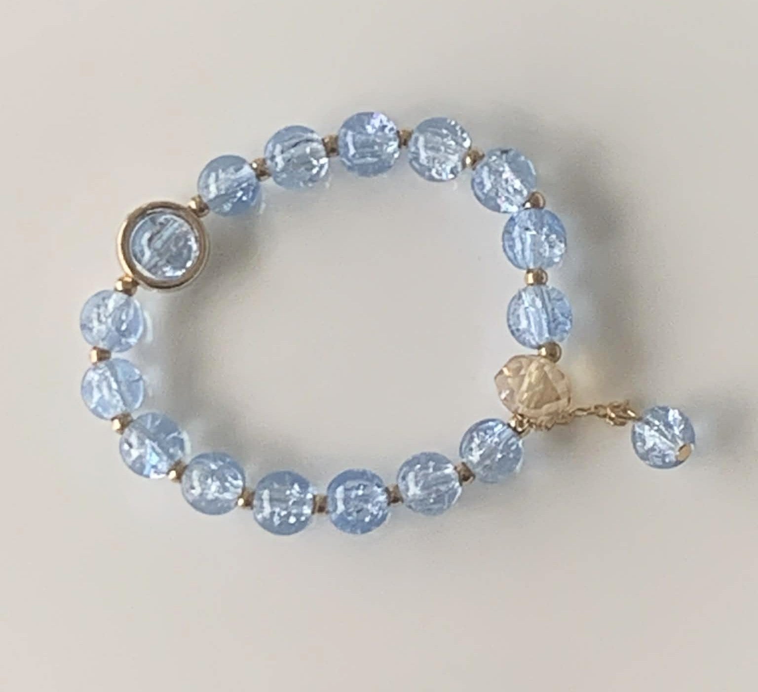 Baby Blue Crackle Glass Stretch Bracelet with Gold Rose & Droplet Charms