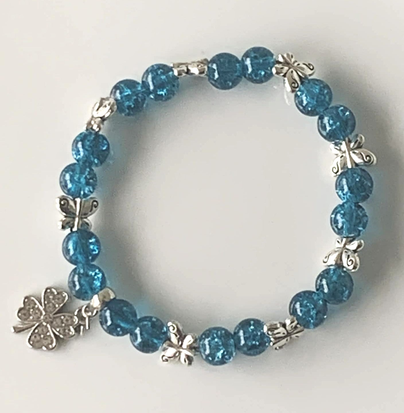 Teal Blue Crackle Glass Stretch Bracelet with Silver Butterfly & Clover Charms