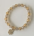 Champagne & Smoky Crystal Rondelle Stretch Bracelet with Gold Spacers & Clover Charm