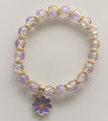 Lilac Crackle Glass Stretch Bracelet with Gold Rondelle Spacers & Daisy Charm