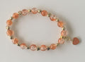 Peach Crackle Glass Stretch Bracelet with Gold Nugget Spacers & Peach Heart Charm