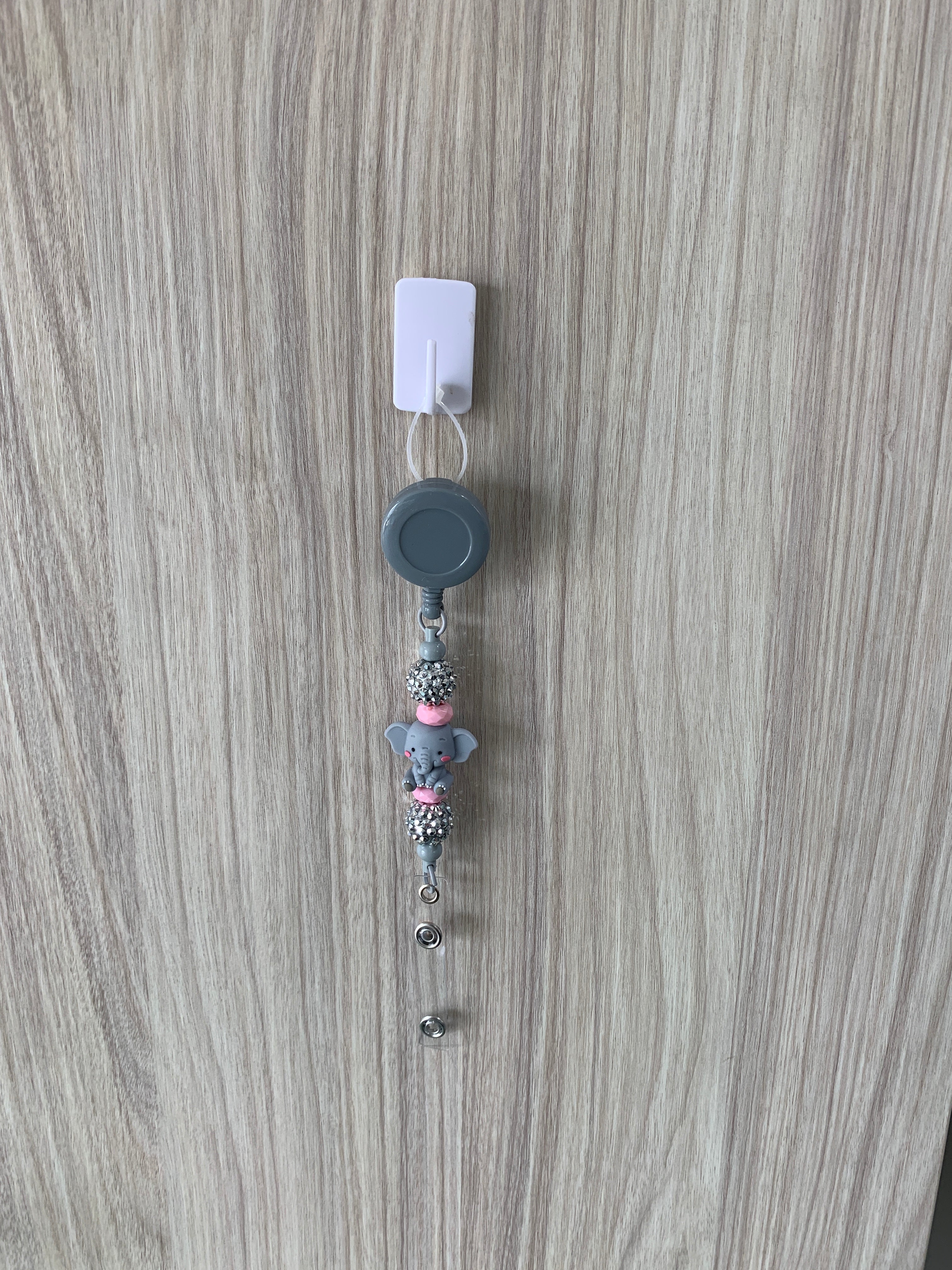 Handmade elephant beaded belt clip in grey and pink