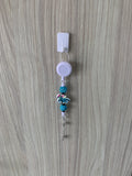 Handmade teal and white bicycle beaded belt clip with floral basket charm