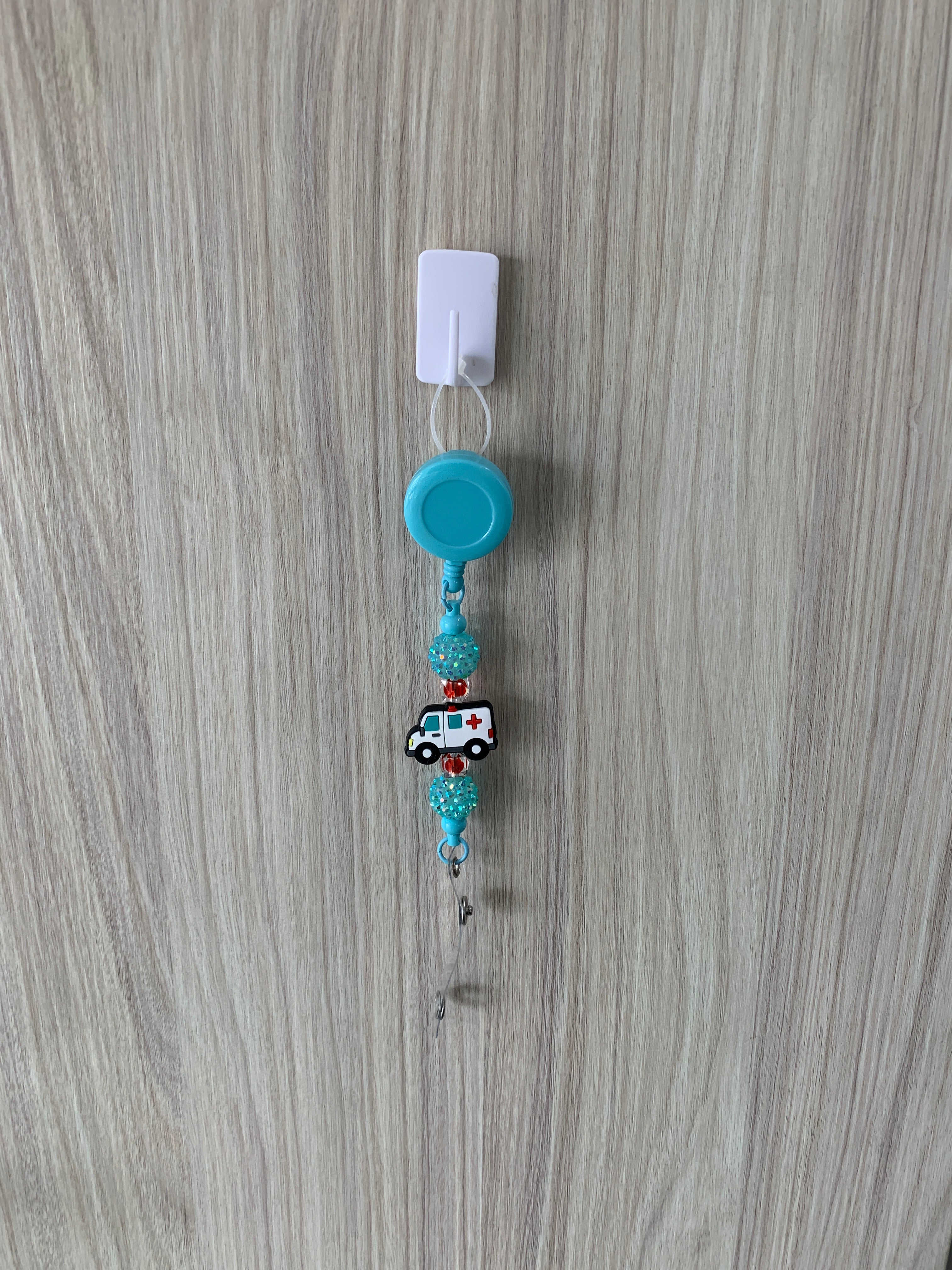 Handmade teal ambulance beaded belt clip