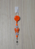 Handmade orange and lavender butterfly beaded belt clip